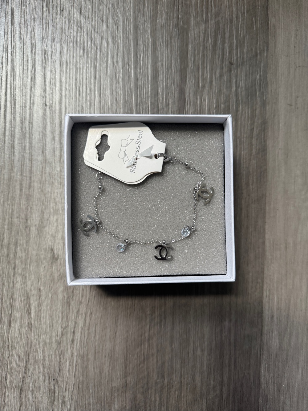 CHNL Silver Charm Bracelet with Interlocking Logo and Crystals